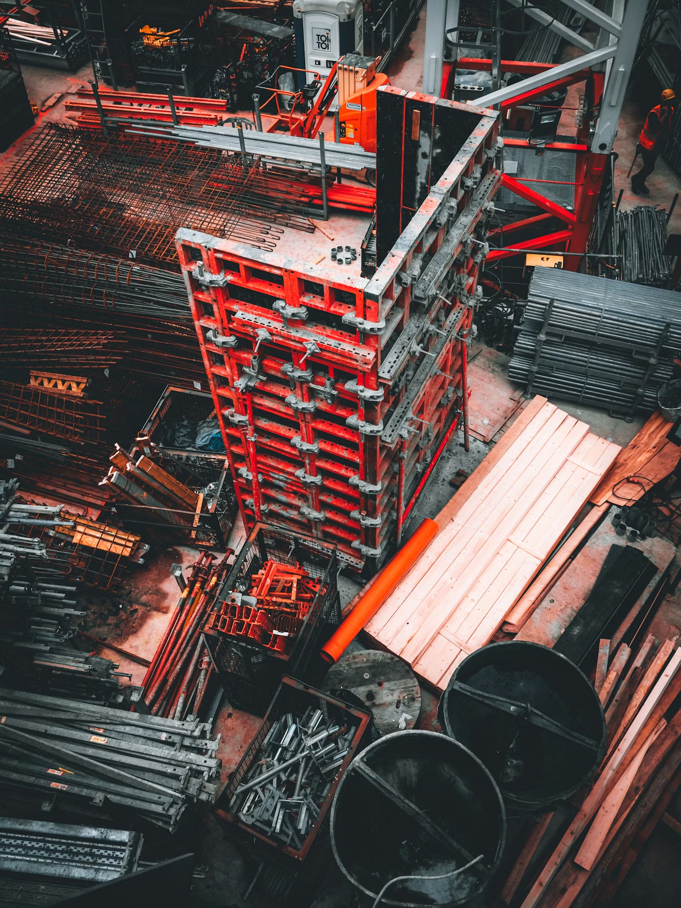 Construction site with various materials and equipment